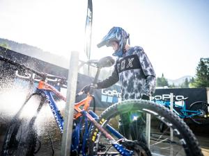 a man is washing his bike in the rain at Landal Brandnertal in Bürserberg +30 photos