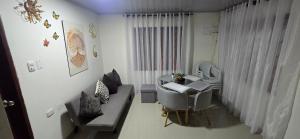 a small living room with a table and a couch at Cerete Apartment 111 in Cereté