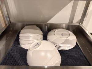 three toilets sitting in a corner of a refrigerator at 城北ノイエ by mooi in Aizuwakamatsu +6 photos