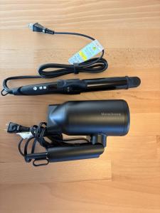 a hair dryer sitting on top of a wooden floor at 城北ノイエ by mooi in Aizuwakamatsu