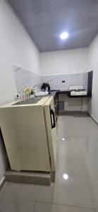 a kitchen with a sink and a counter top at Cerete Apartment 111 in Cereté