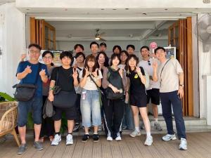 a group of people posing for a picture at Unplugged at Bangrak & Silom Design Hostel in Bangkok