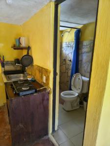 a small bathroom with a sink and a toilet at Cabañas la garita2 in San Cristóbal de Las Casas +111 photos