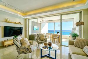 a living room with a view of the ocean at Marbellaluxessence Beachfrontpool11Thfloor in Villas del Mar