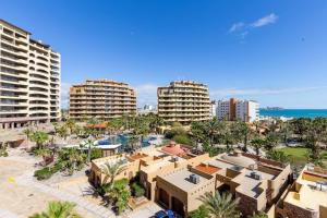 an aerial view of a resort with palm trees and buildings at Sandy Beach Rocky Point Bella Sirena 203-E in Puerto Peñasco