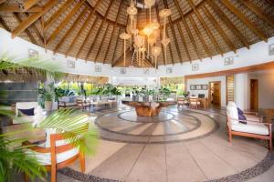 a large lobby with a chandelier and a fountain at Sublimeluxcondo Terrenas Jaccuzibeachfront in Las Terrenas