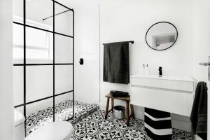 a bathroom with a shower and a sink and a mirror at Quiet Central Home Near Newlands Cricket in Cape Town +20 photos