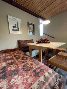 a living room with a table and a rug at Love Nest In Pringle Bay in Pringle Bay