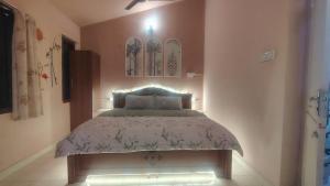 a bedroom with a bed in a room at yercaud Happy valley cottage in Yercaud
