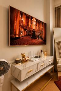 a living room with a large painting on the wall at LuxeInn in Trece Martires