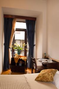 Postel nebo postele na pokoji v ubytování Hotel Montecarlo