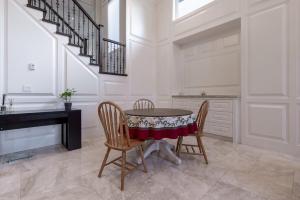 a dining room with a table and chairs at Private Room in Richmond in Richmond +12 photos