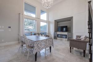 a dining room with a table and chairs and a television at Private Room in Richmond in Richmond