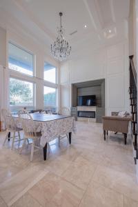 a dining room with a table and chairs and a chandelier at Private Room in Richmond in Richmond
