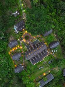 an overhead view of a house with lights on it at Plaga Eco Village by Nabe Hospitality Management in Plaga +16 photos