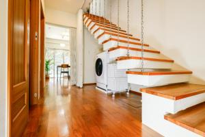 a living room with wooden floors and a staircase at 栞-shiori-NAKASONE in Miyako-jima +14 photos