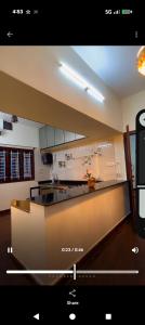 a kitchen with a counter top in a room at Cherry guest House Shringeri ,koppa rural in Chikmagalur
