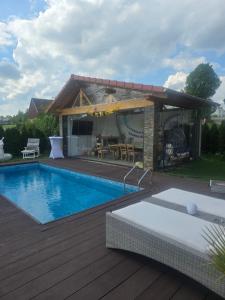 a house with a swimming pool and a pavilion at Karolingerweg Gäst Haus in Lauterhofen