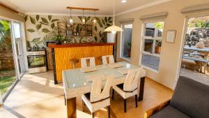 a dining room with a table and chairs at Joy Haven - Open Plan Studio in Centurion
