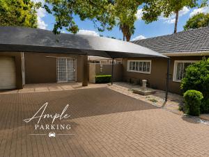 a house with a driveway in front of it at Joy Haven - Open Plan Studio in Centurion