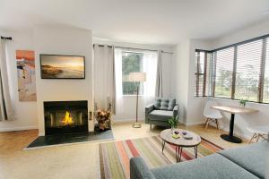a living room with a couch and a fireplace at SCP Mendocino Inn and Farm in Little River