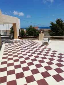 a checkered floor in the middle of a patio at Dari in El Haouaria