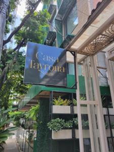 a sign on the side of a building at Casa Tayrona Suites in Medellín