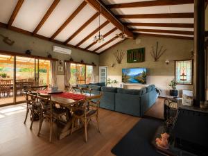 a living room with a table and a couch at Pecan Hill BNB in Toodyay