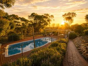 a swimming pool with a fence around it at Pecan Hill BNB in Toodyay