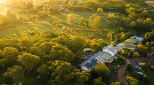 an aerial view of a house in a field at Pecan Hill BNB in Toodyay