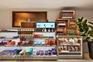 a store with a display of food and drinks at SOL by Meliá House Mallorca - Adults Only in Magaluf +38 photos