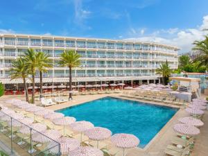 a hotel with a pool and chairs and umbrellas at SOL by Meliá House Mallorca - Adults Only in Magaluf