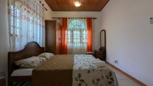 a bedroom with a bed and a window at Margarita Leisure in Wadduwa