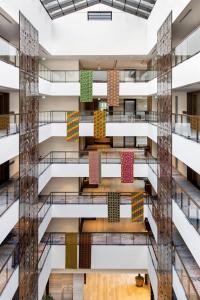 a view of the lobby of a building with colorful tiles at Gran Meliá Arusha in Arusha +117 photos