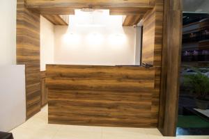 a wooden door with a window on top at Hotel O Sai Plaza in Aurangabad +19 photos