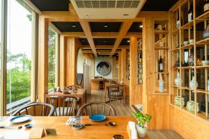 a dining room with a table and chairs at Kalima Resort and Spa in Patong Beach