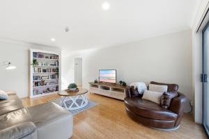 a living room with a couch and a table at Stylish 2-Bed Apartment in Kingston in Kingston 