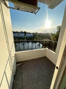 a balcony with a view of the water at Comfy hotels Suvarnabhumi in Suvarnabhumi Airport
