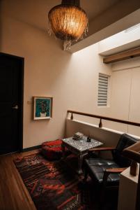 a living room with a table and a couch at Chloechen Home in Taitung City