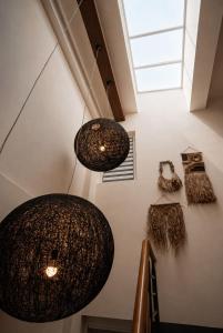 two large spheres hanging from the ceiling in a room at Chloechen Home in Taitung City