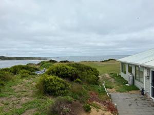 a house with a view of the ocean at Devils Gap in Currie +3 photos