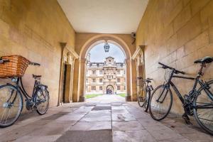 two bikes parked in a hallway in front of a building at Cambridge Narrowboats - Beautiful New Moon Narrowboat in Cambridge