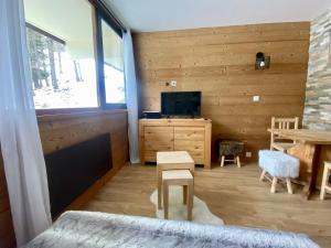 a bedroom with a bed and a table and a television at Welcome to Star Vars! in Vars