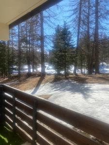 a window view of a yard with snow and trees at Welcome to Star Vars! in Vars