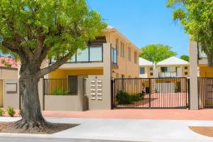 a house with a gate and a tree at Midland Haven - Midland WA in Midland Junction