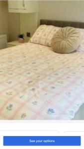 a picture of a bed with a pillow on it at Lakeside in Carrowmoreknock
