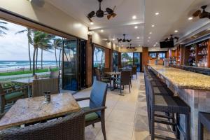 a restaurant with a view of the ocean at Wyndham Deerfield Beach Resort in Deerfield Beach