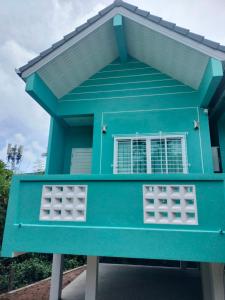 a blue house with a window on top of it at Aysaii Home01 in Panwa Beach