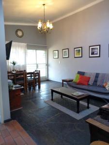 a living room with a couch and a table at Karee Laagte in Leeuwfontein