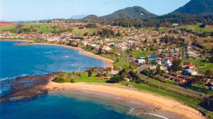 an aerial view of a town on the beach at Penguin Beach House in Penguin